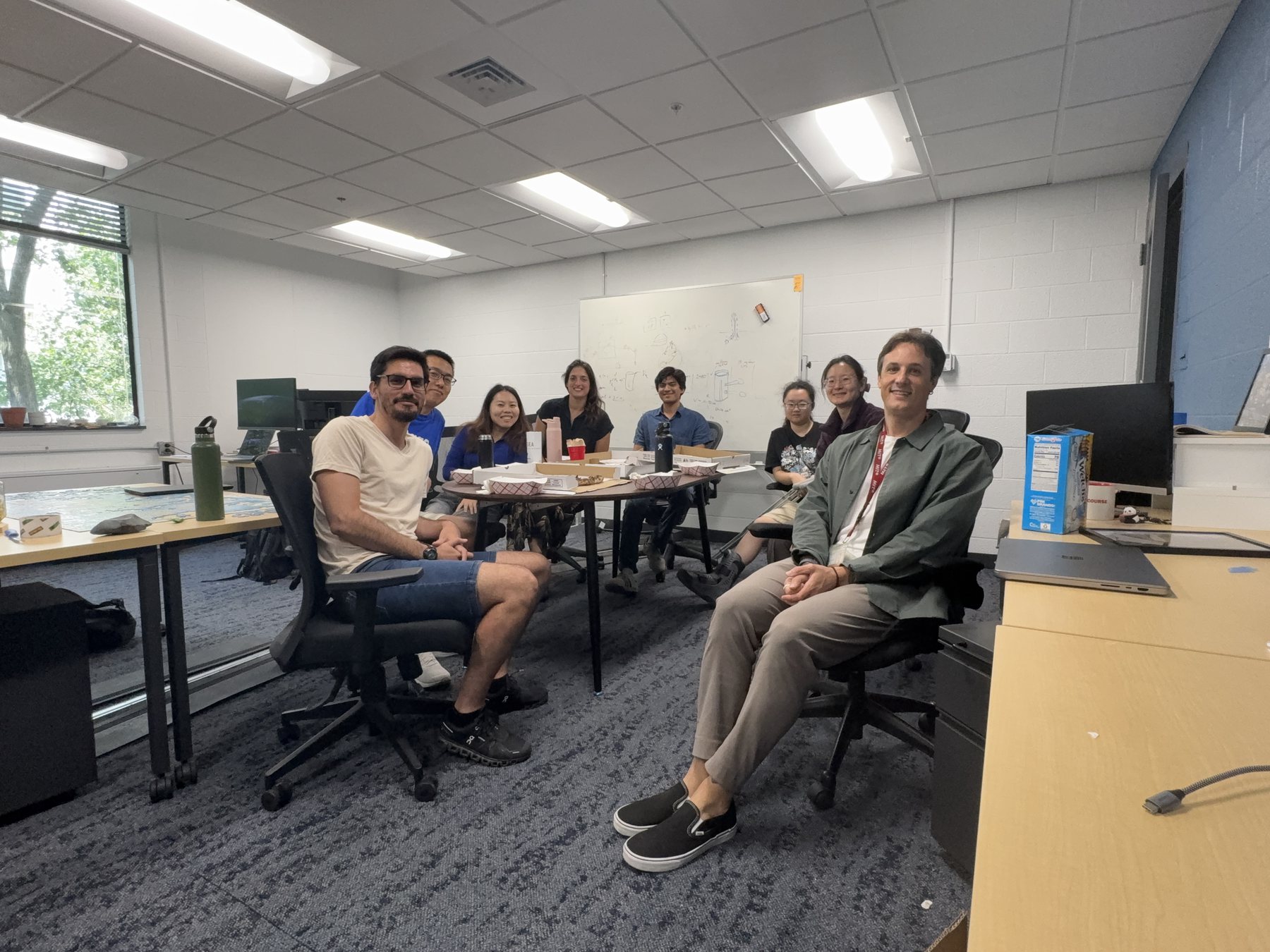 The Terrer Lab at a Pizza & Science meeting in the new group space